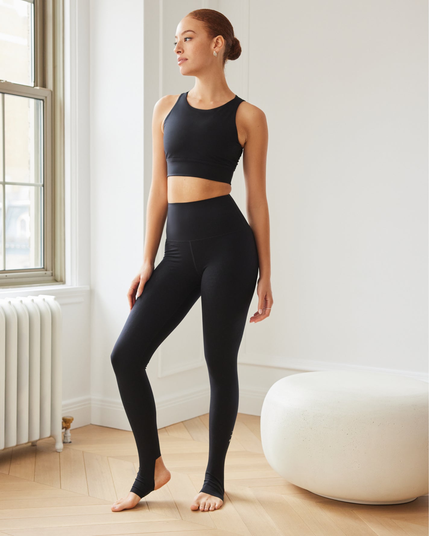 Model wearing the L’Original bra in black color, made from OEKO-TEX® certified compression fabric with Elastique’s MicroPerle® technology to enhance circulation, support lymphatic drainage, and provide pain relief.