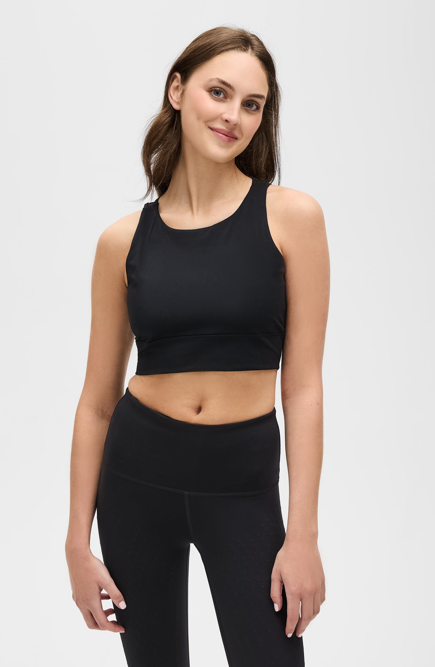 Model wearing the L’Original bra in black color, made from OEKO-TEX® certified compression fabric with Elastique’s MicroPerle® technology to enhance circulation, support lymphatic drainage, and provide pain relief.