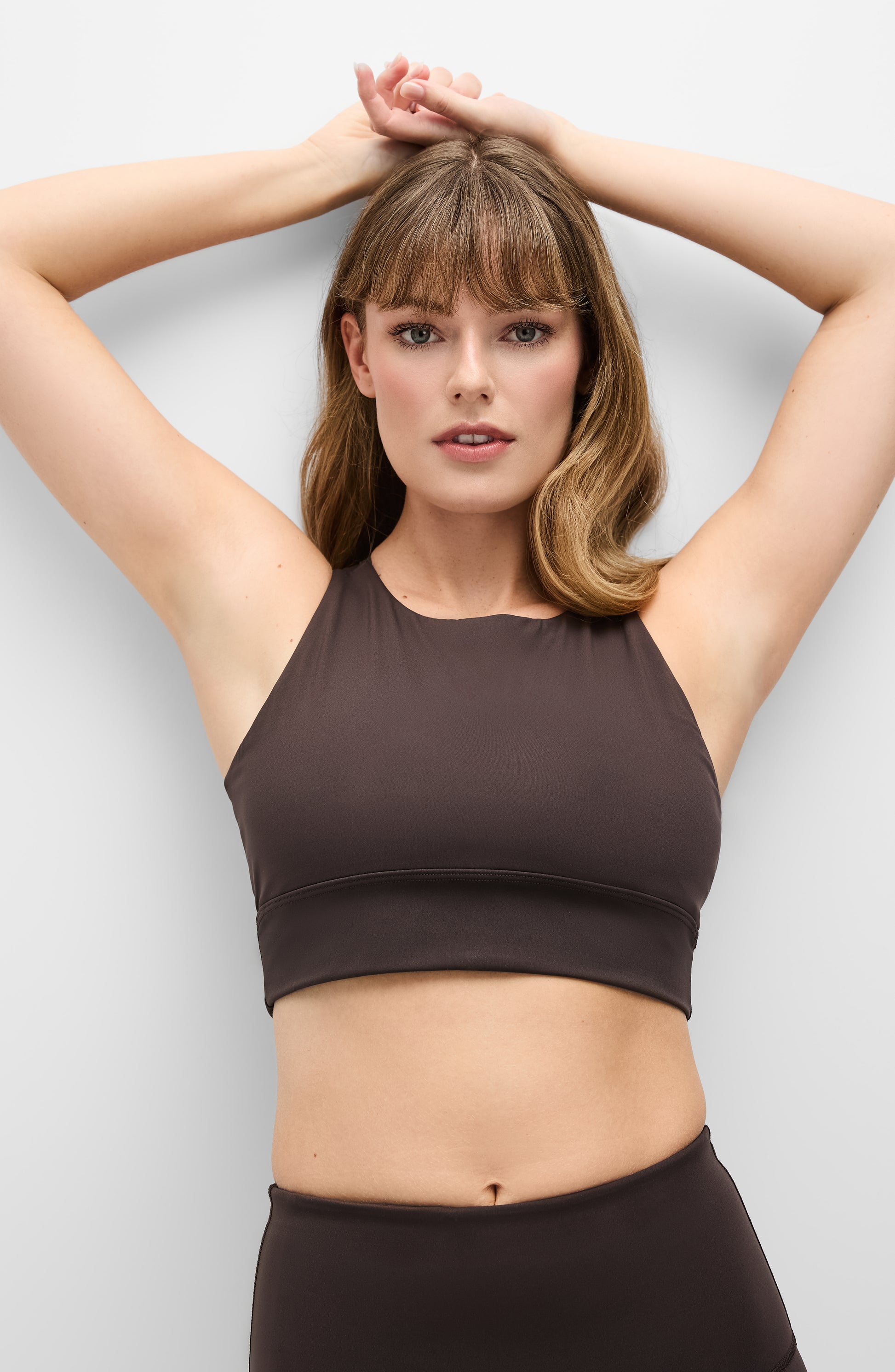 Model wearing the L’Original bra in Java brown color, made from OEKO-TEX® certified compression fabric with Elastique’s MicroPerle® technology to enhance circulation, support lymphatic drainage, and provide pain relief.