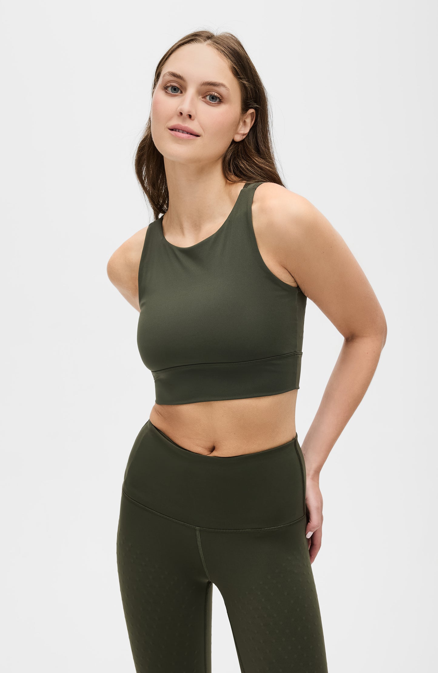 Model wearing the L’Original bra in olive green color, made from OEKO-TEX® certified compression fabric with Elastique’s MicroPerle® technology to enhance circulation, support lymphatic drainage, and provide pain relief.