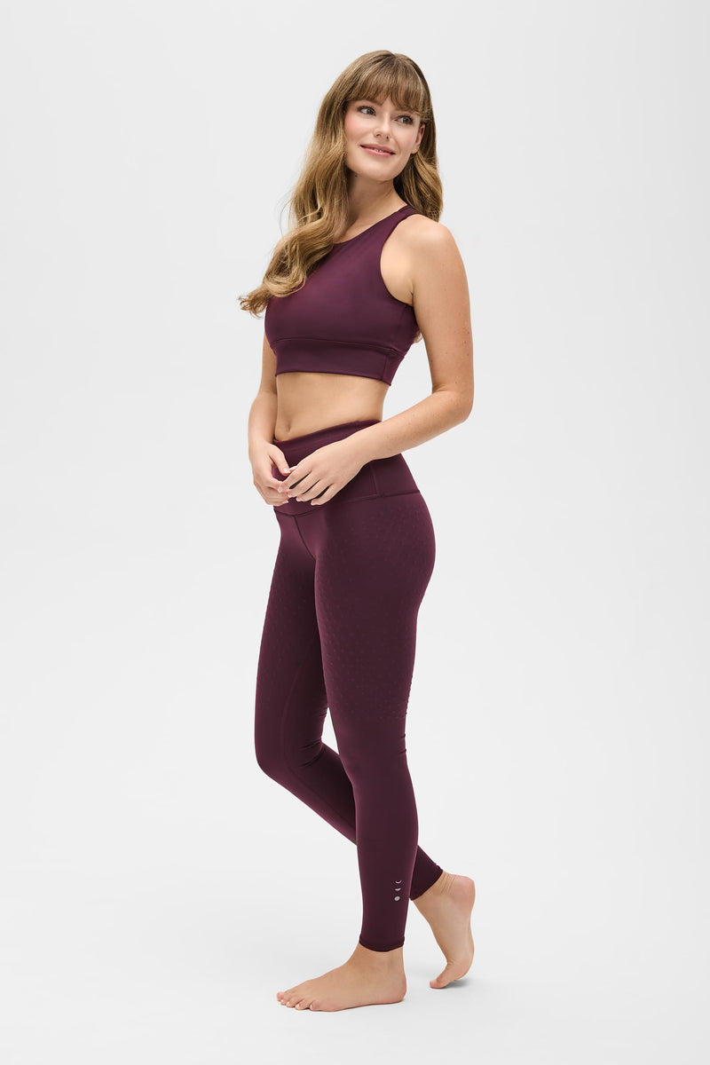 Model wearing L'Original set in fig color, made from OEKO-TEX® certified compression fabric with Elastique’s MicroPerle® technology to enhance circulation, promote lymphatic drainage, and relieve pain.