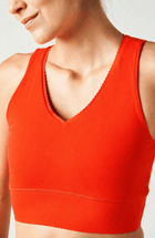 Adorn bra in poppy color featuring an elegant scallop trim, crafted from OEKO-TEX® certified compression fabric with Elastique’s MicroPerle® technology to promote lymphatic drainage, improve circulation, and reduce fatigue.