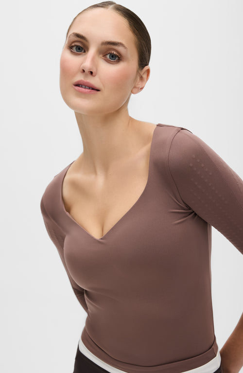 Load image 1 in gallery view. Iconic 3/4 Sleeve MicroPerle® top in cappuccino color featuring MicroPerle® bead panels on the upper arms and back, designed to boost the lymphatic system, improve circulation, and smooth the skin with OEKO-TEX® certified compression fabric.