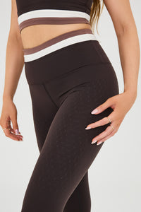 Le Monde leggings and bra in Java, Ivory, and Cappuccino colors made from OEKO-TEX® certified compression fabric featuring Elastique’s MicroPerle® technology to promote lymphatic drainage, improve circulation, reduce fatigue, and smooth the skin.