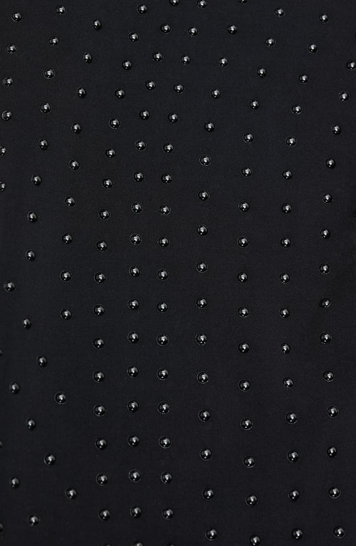 Load image 1 in gallery view. Close-up of Elastique’s MicroPerle® technology on black compression fabric, showing the textured microbeads designed to stimulate lymphatic drainage, improve circulation, and smooth the skin.