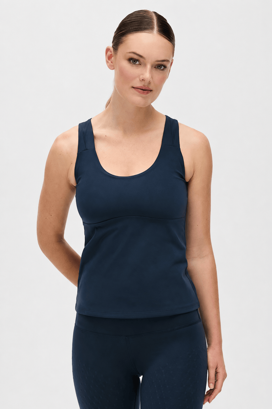 Model wearing L'Original lymphatic tank and leggings in navy blue