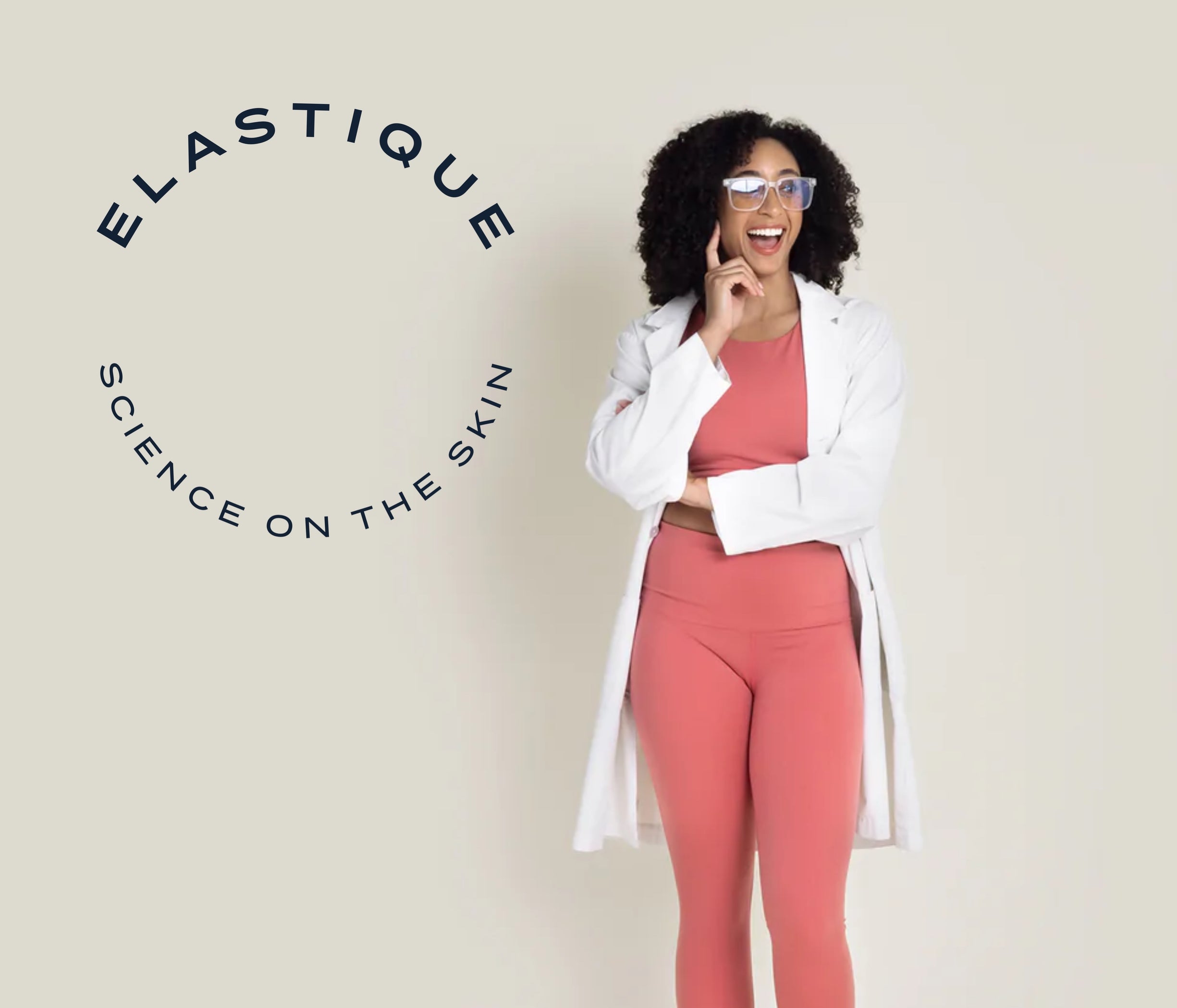 Women wearing elastic bottoms and top in a lab coat in front of off white background. Words "Elastique Science on the skin" creating a circle to the left of model.