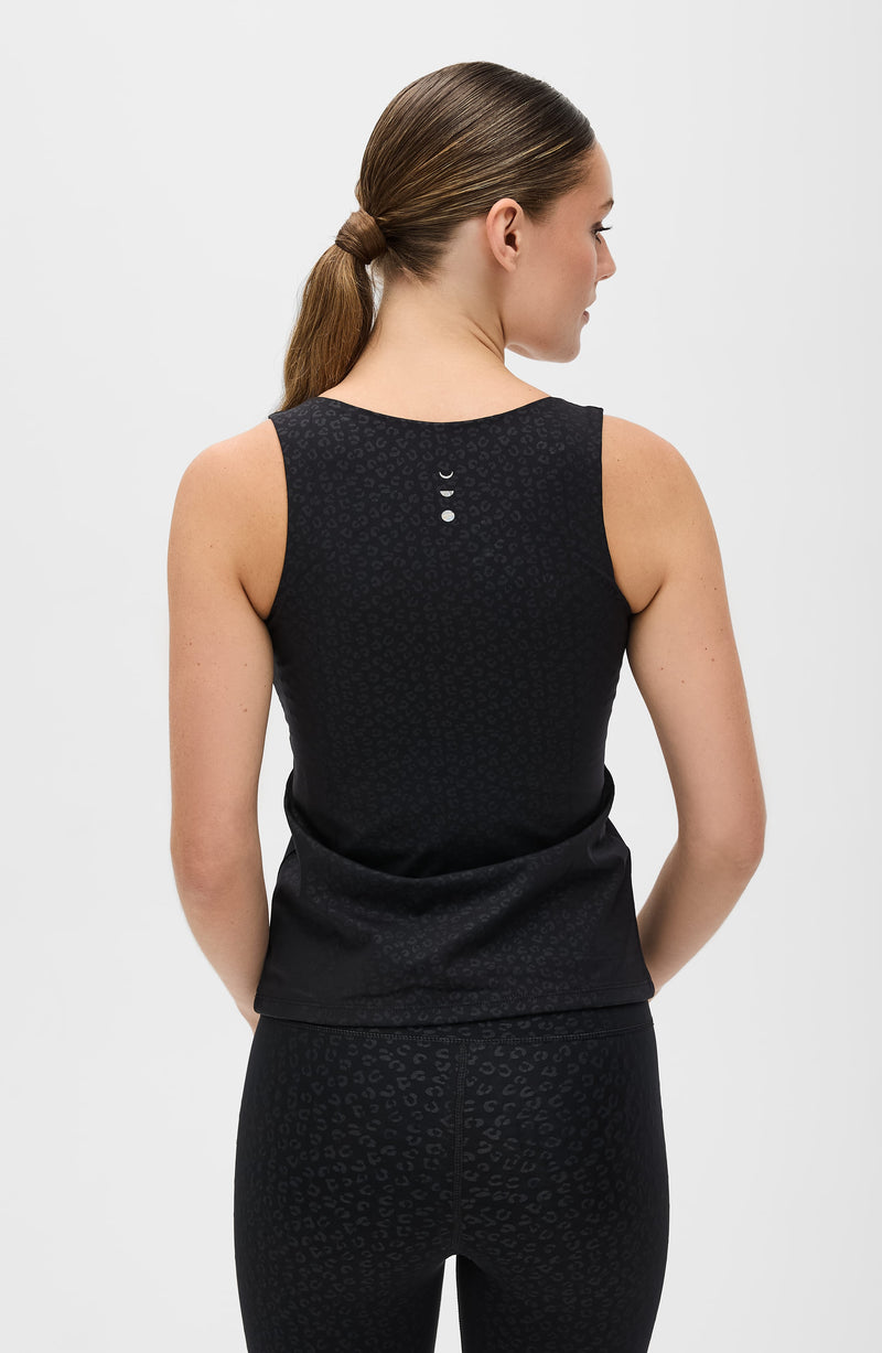 Fierce tank in cheetah print from Elastique’s Fierce collection, made from OEKO-TEX® certified compression fabric with MicroPerle® technology to enhance circulation, support lymphatic drainage, and smooth the skin.