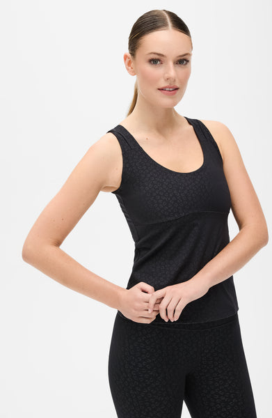 Fierce tank in cheetah print from Elastique’s Fierce collection, made from OEKO-TEX® certified compression fabric with MicroPerle® technology to enhance circulation, support lymphatic drainage, and smooth the skin.
