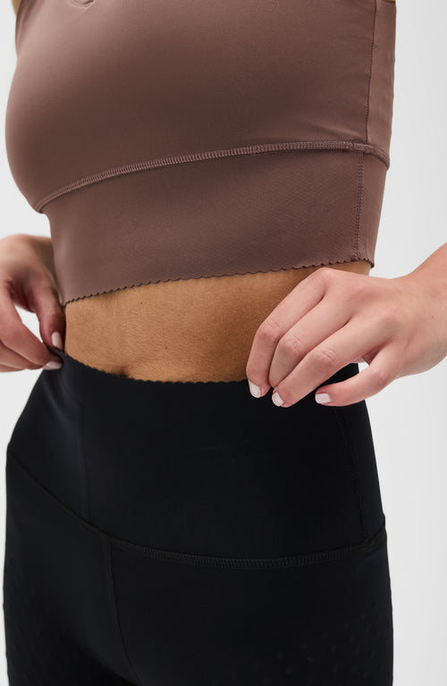 Load image 1 in gallery view. Adorn leggings in black & Adorn bra in cappuccino featuring an elegant scallop trim, made from OEKO-TEX® certified compression fabric with Elastique’s MicroPerle® technology to promote lymphatic drainage, boost circulation, reduce fatigue, and smooth the skin.