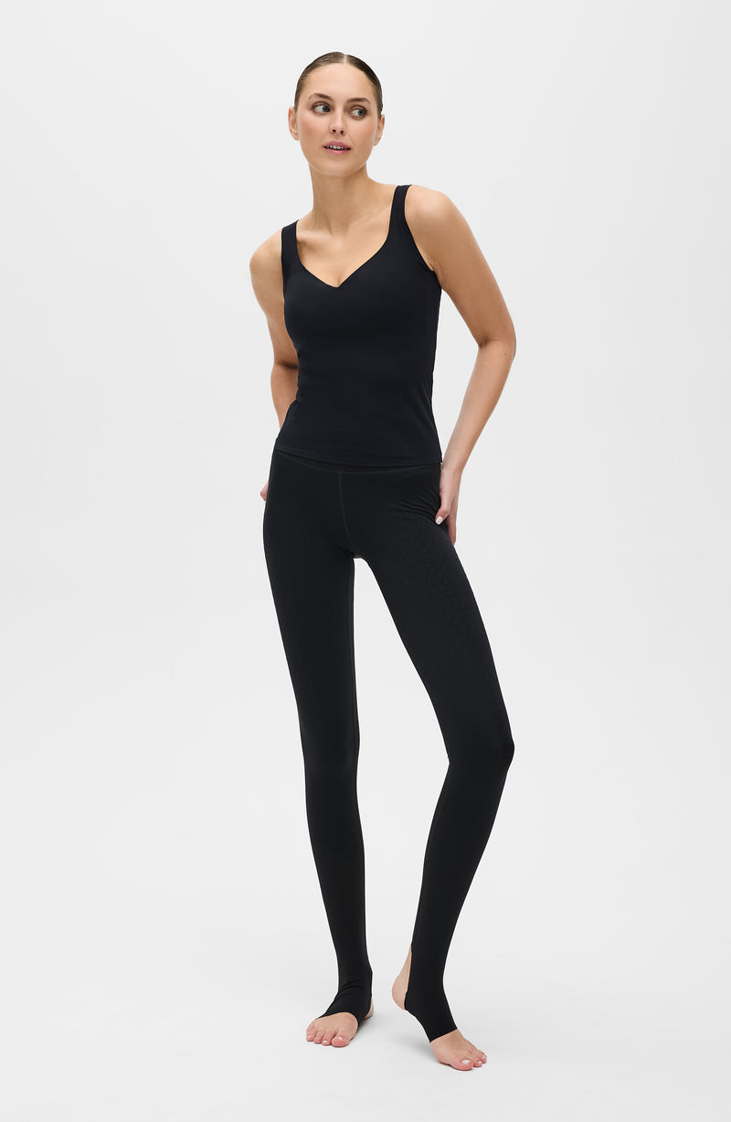 Iconic MicroPerle® tank in black, made from OEKO-TEX® certified compression fabric featuring Elastique’s patented MicroPerle® technology to enhance circulation, promote lymphatic drainage, and smooth the skin for an elevated performance fit.