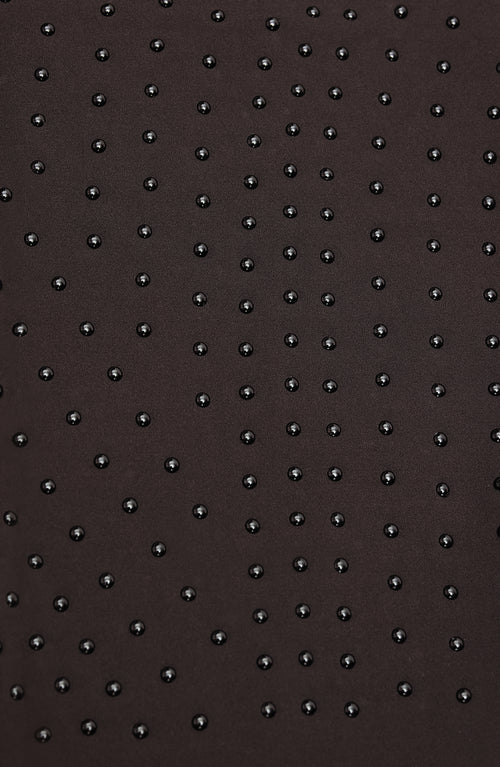 Load image 1 in gallery view. Close-up of Elastique’s MicroPerle® technology in java brown compression fabric, showing the textured microbeads designed to stimulate lymphatic drainage, improve circulation, and smooth the skin.
