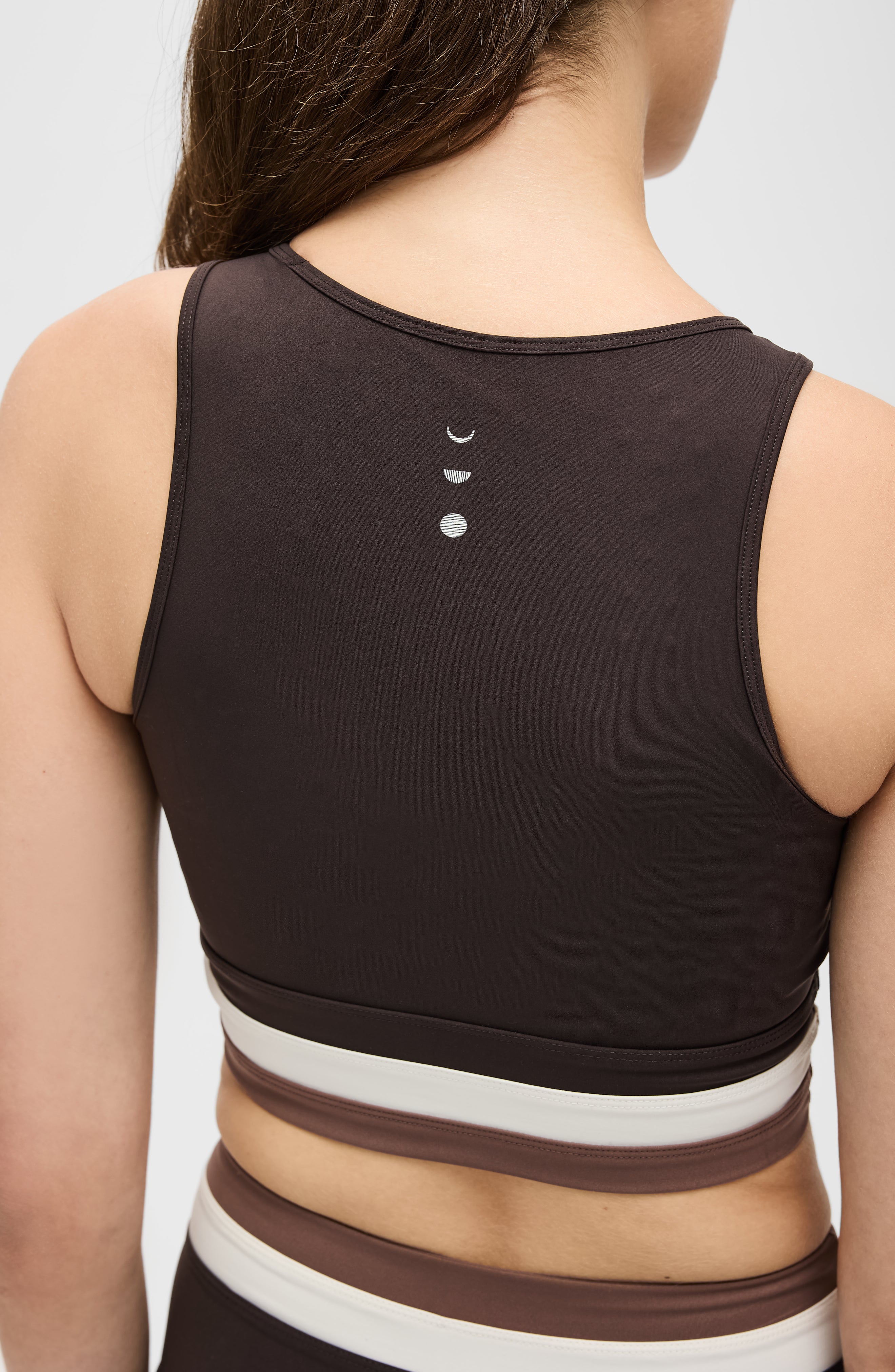 Model wearing the Le Monde bra in Java, Ivory, and Cappuccino colors, made from OEKO-TEX® certified compression fabric featuring Elastique’s MicroPerle® technology to improve circulation, support lymphatic drainage, and relieve pain.