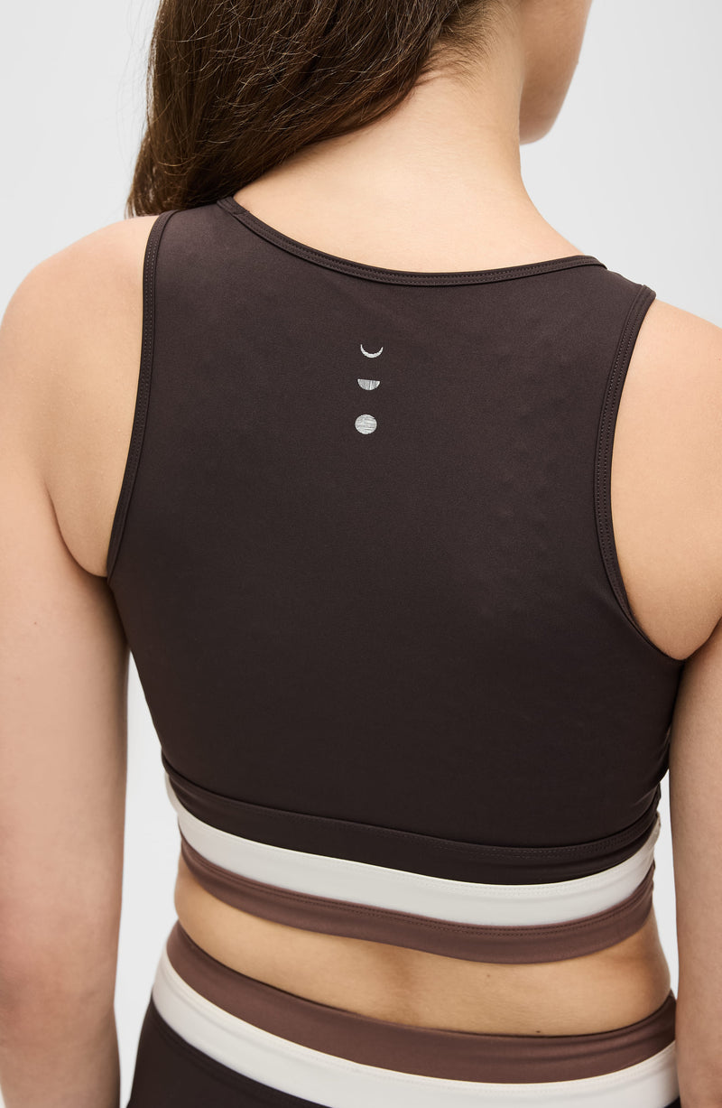 Model wearing the Le Monde bra in Java, Ivory, and Cappuccino colors, made from OEKO-TEX® certified compression fabric featuring Elastique’s MicroPerle® technology to improve circulation, support lymphatic drainage, and relieve pain.