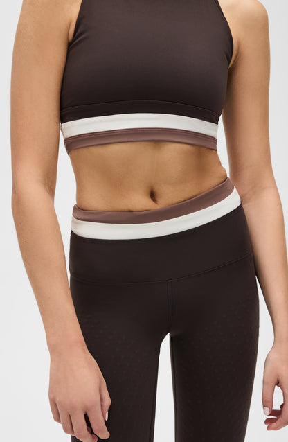 Le Monde leggings and bra in Java, Ivory, and Cappuccino colors made from OEKO-TEX® certified compression fabric featuring Elastique’s MicroPerle® technology to promote lymphatic drainage, improve circulation, reduce fatigue, and smooth the skin.