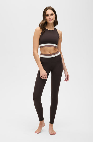 Le Monde leggings and bra in Java, Ivory, and Cappuccino colors made from OEKO-TEX® certified compression fabric featuring Elastique’s MicroPerle® technology to promote lymphatic drainage, improve circulation, reduce fatigue, and smooth the skin.