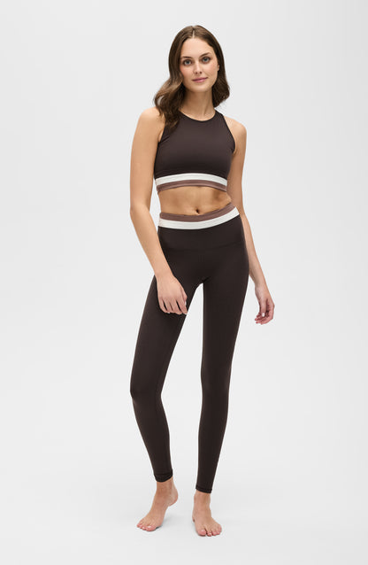 Le Monde leggings and bra in Java, Ivory, and Cappuccino colors made from OEKO-TEX® certified compression fabric featuring Elastique’s MicroPerle® technology to promote lymphatic drainage, improve circulation, reduce fatigue, and smooth the skin.