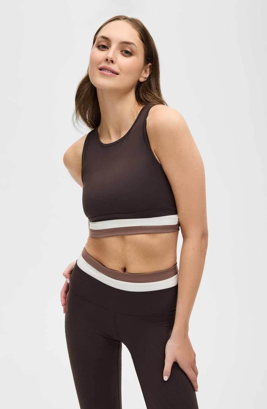 Model wearing Le Monde compression bra in java, ivory and cappuccino