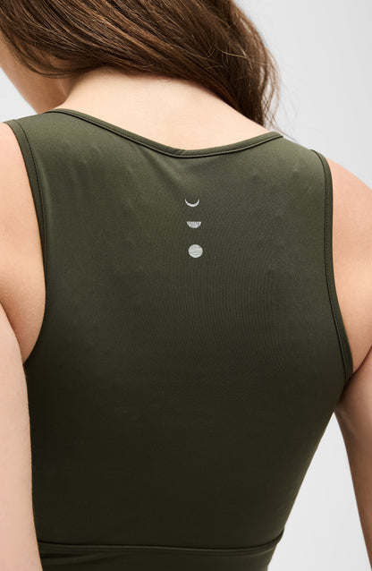 Model wearing the L’Original bra in olive green color, made from OEKO-TEX® certified compression fabric with Elastique’s MicroPerle® technology to enhance circulation, support lymphatic drainage, and provide pain relief.