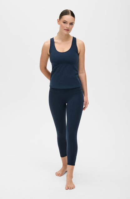 L’Original Leggings 21'' capri length in Navy blue with matching L’Original Bra, made from OEKO-TEX® certified compression fabric featuring Elastique’s MicroPerle® technology to promote lymphatic drainage, enhance blood circulation, reduce fatigue, and smooth the skin.