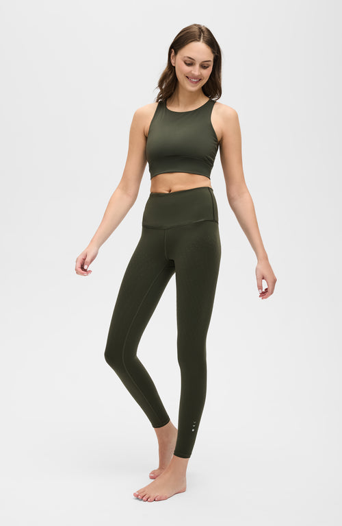 Load image 1 in gallery view. L’Original Leggings in olive green with matching L’Original Bra, made from OEKO-TEX® certified compression fabric featuring Elastique’s MicroPerle® technology to promote lymphatic drainage, enhance blood circulation, reduce fatigue, and smooth the skin.