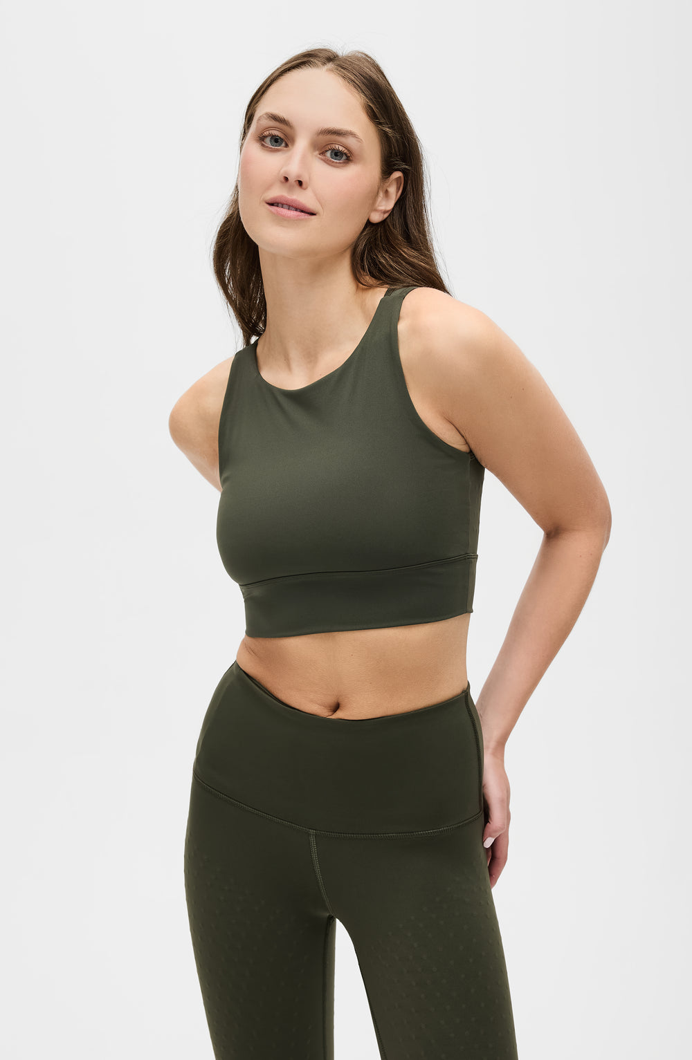 Model wearing the L’Original bra in olive green color, made from OEKO-TEX® certified compression fabric with Elastique’s MicroPerle® technology to enhance circulation, support lymphatic drainage, and provide pain relief.