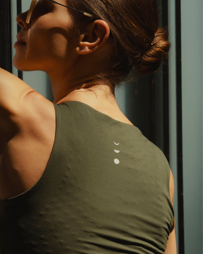 Model wearing Le Divine bra in olive with MicroPerle on an oeko-tex compression fabric for better circulation, lymphatic drainage, pain relief